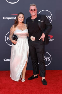 Pat McAfee and his wife Samantha McAfee at a public event